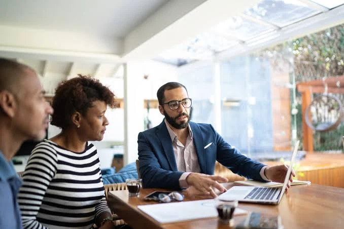 Advisor discussing financial goals with clients